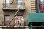 two girls and a boy on a fire escape, nyc