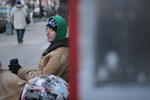 man on a bench, with coffee